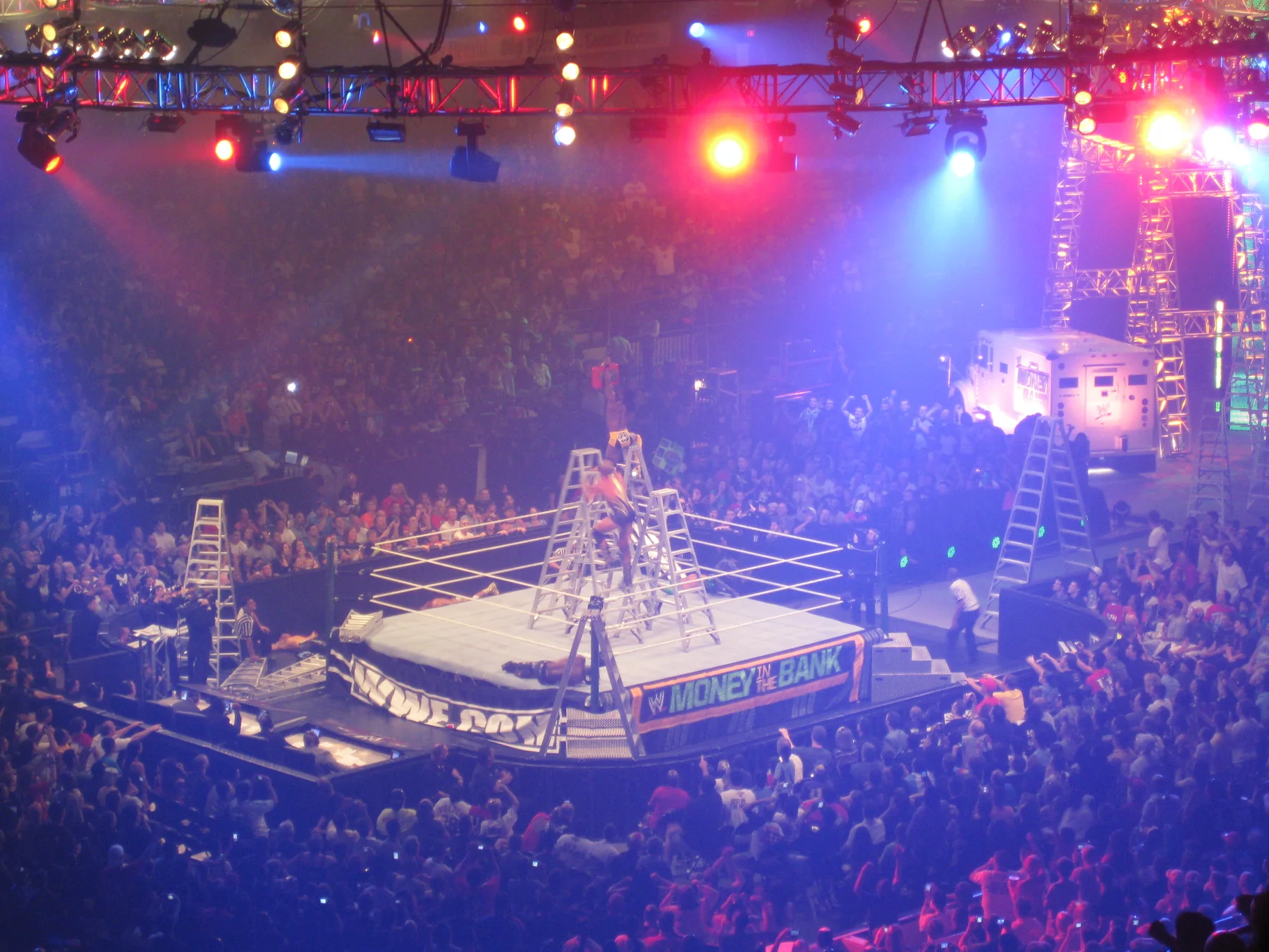 WWE wrestlers battle among ladders during the 2011 Raw Money in the Bank Ladder Match