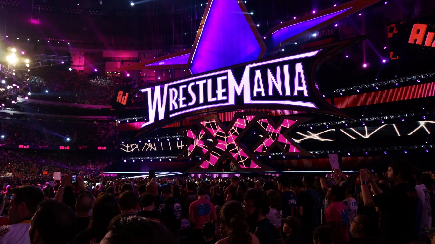 The WrestleMania 30 stage surrounded by a live WWE arena crowd