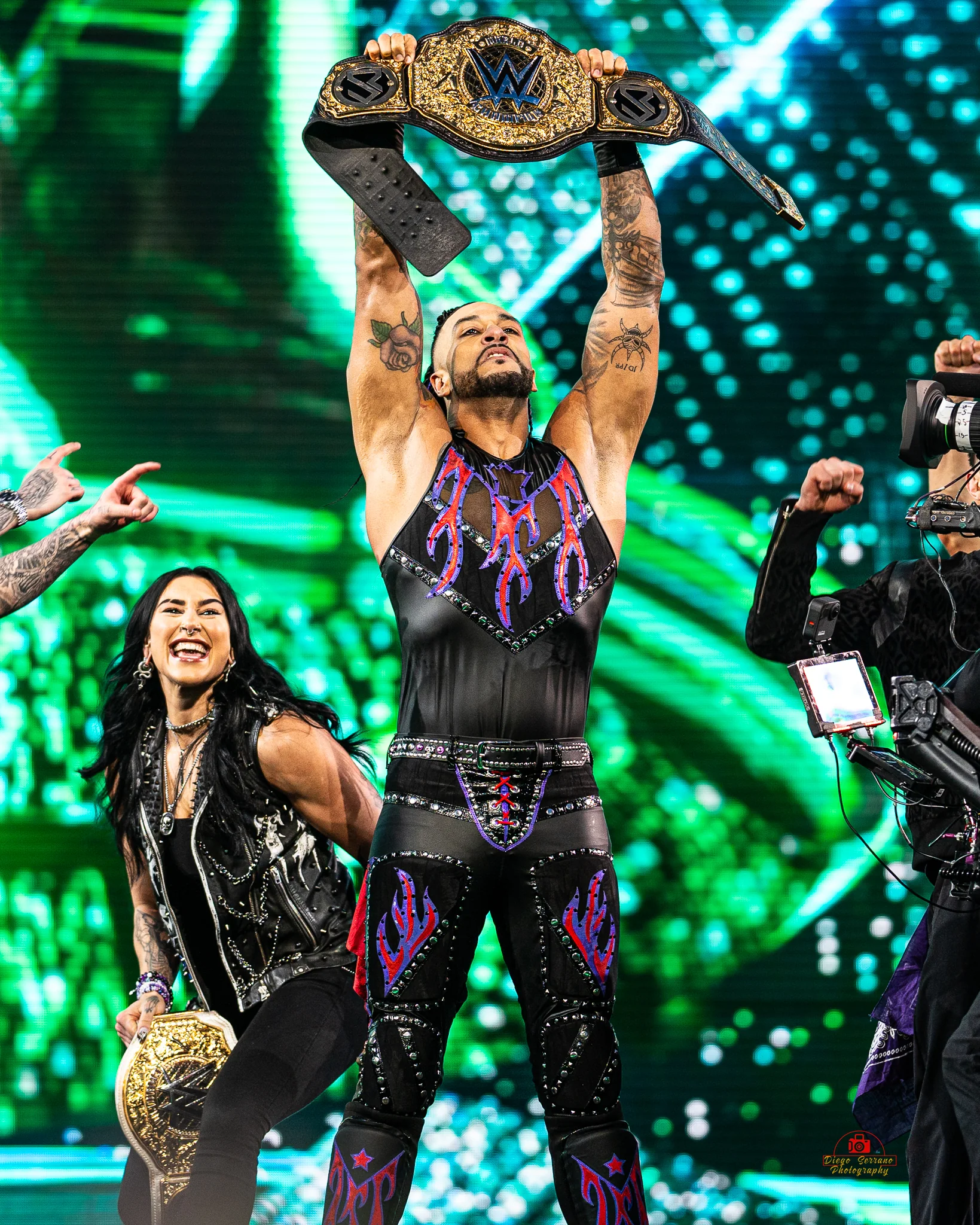Rhea Ripley beside Damian Priest during their WrestleMania XL celebration