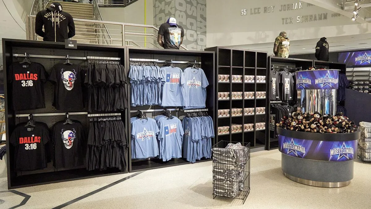 Rows of WWE shirts and event merchandise inside a WrestleMania Superstore